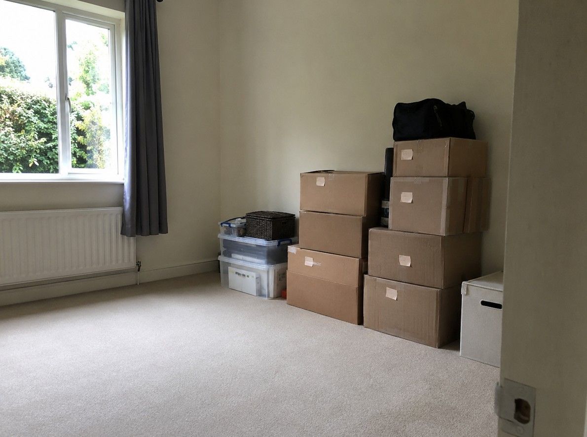 Tenant belongings boxed and set aside during a landlord clearance in Cardiff