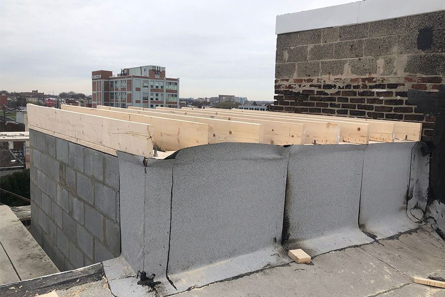 A roof with a wooden platform on top of it