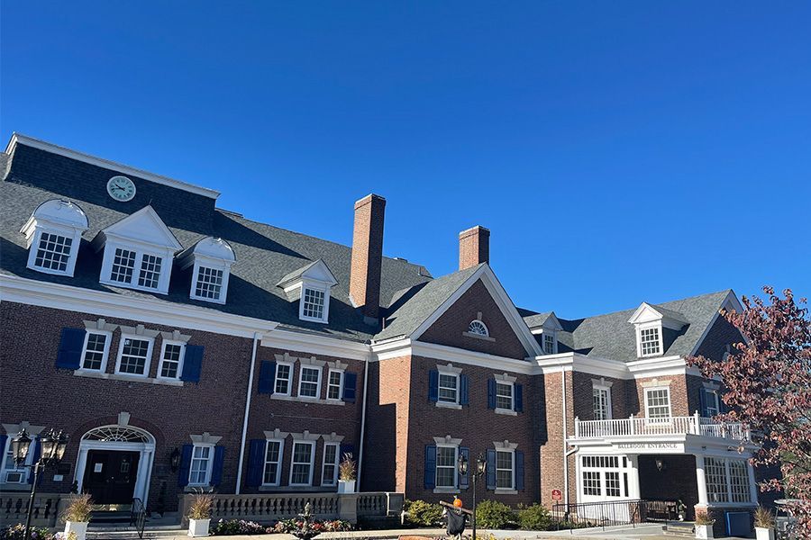 A large brick building with a blue sky in the background