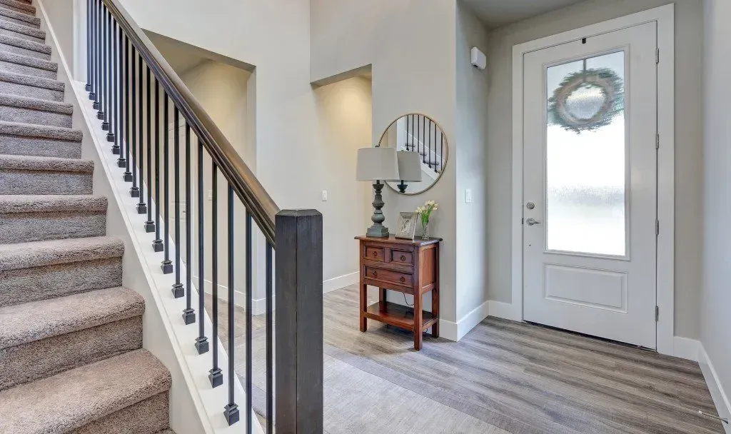 There is a staircase leading up to the second floor of a house