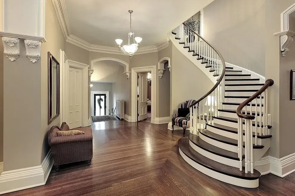 A large hallway with a curved staircase in the middle