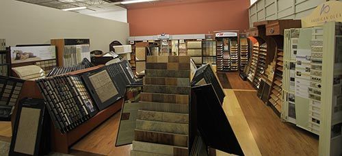 A store filled with lots of different types of carpets