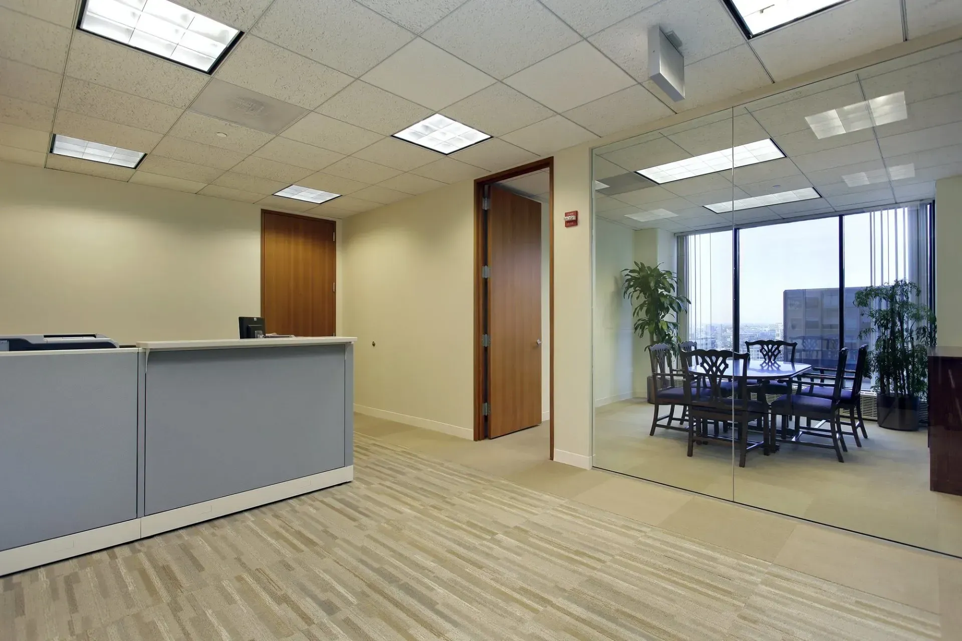 A large room with a table and chairs in it