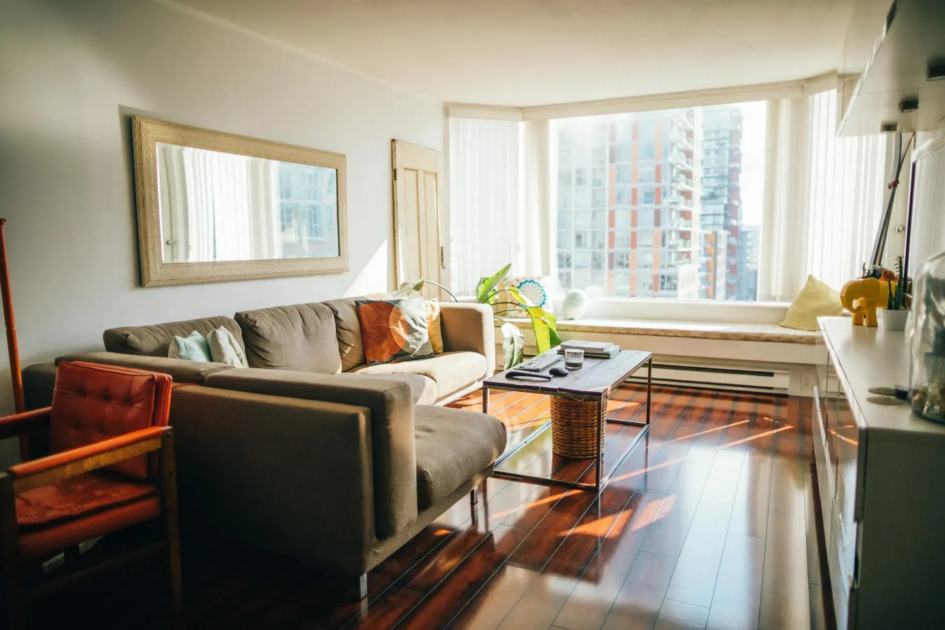 A living room filled with furniture and a large window
