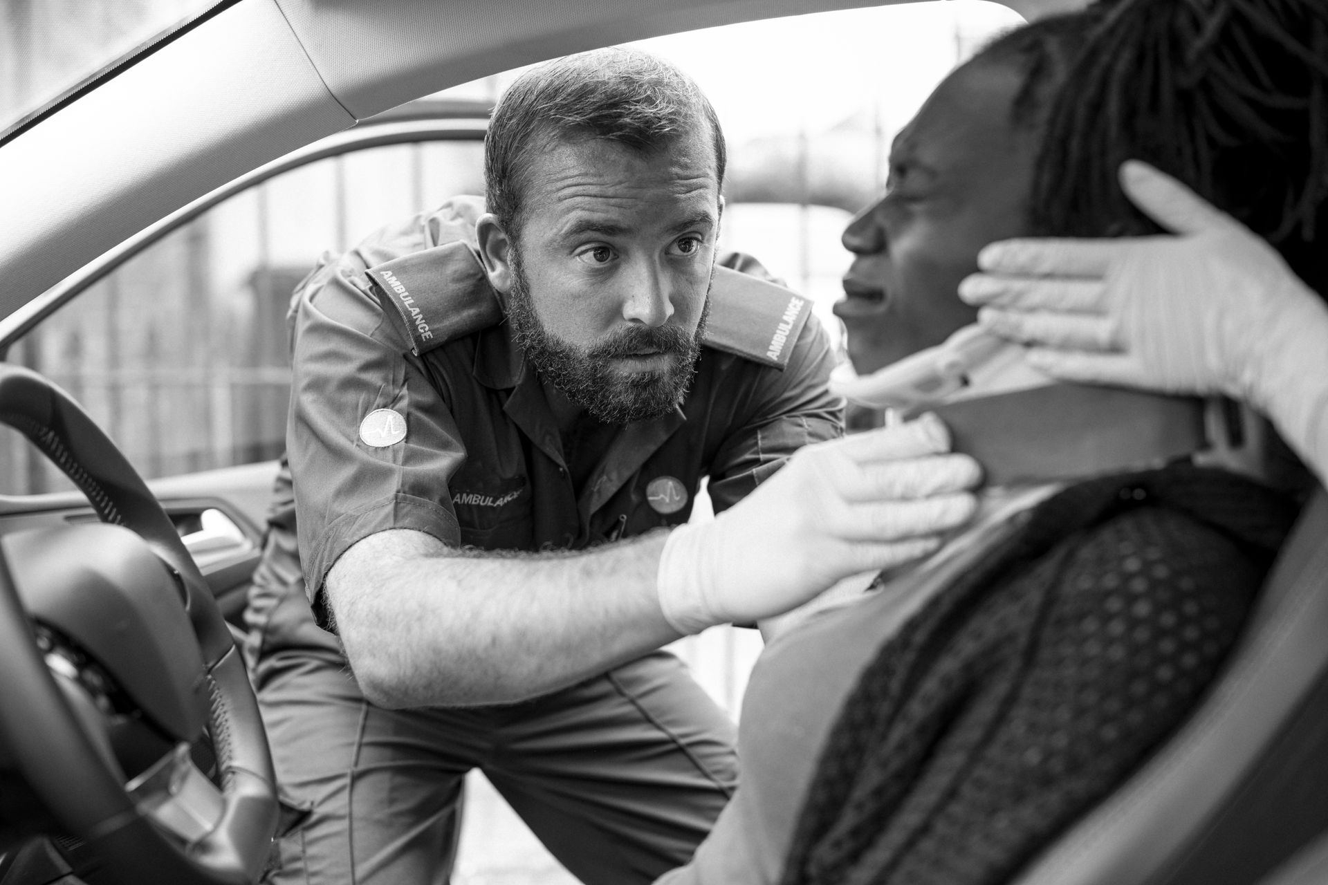 Guy helping an Injured Driver in a Car Accident