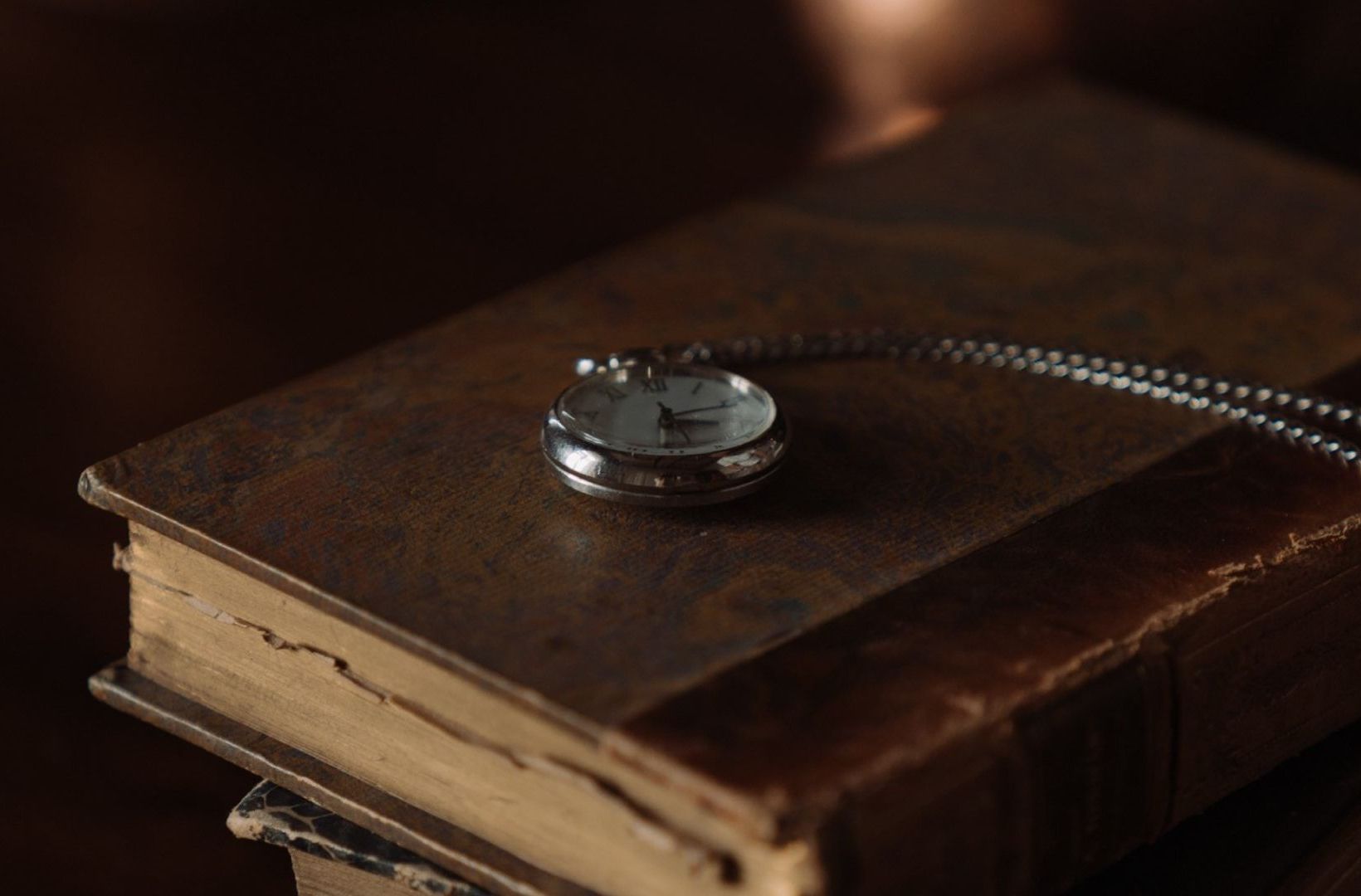  A pocket watch over a book