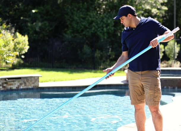 Cleaning Service Man in Swimming Pool- Holmdel, NJ - Suburban Services Inc Cleaning Service Man in Swimming Pool - Holmdel, NJ - Suburban Services Inc