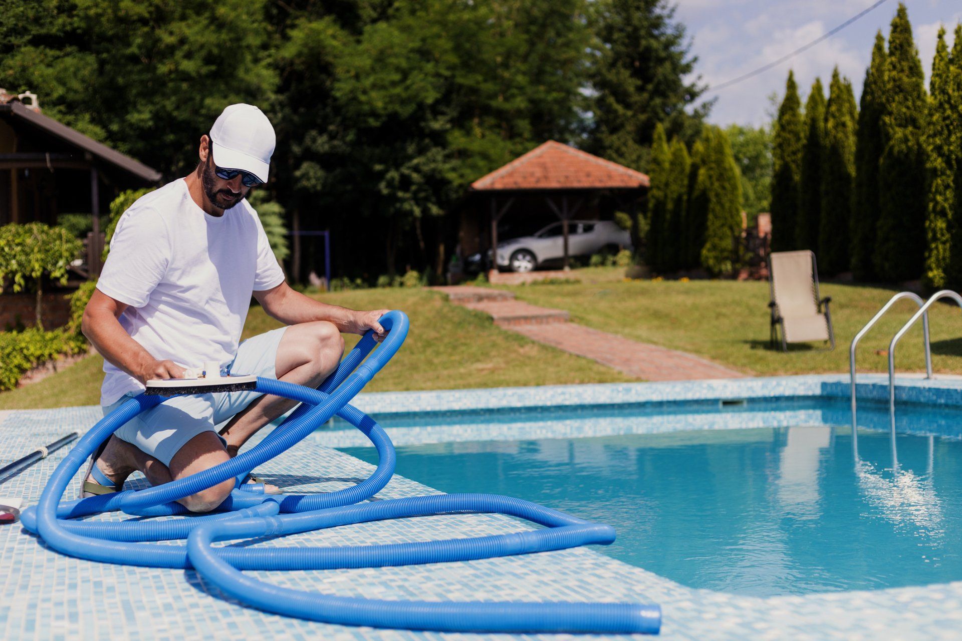Man with Cleaning Equipment in Swimming Pool - Holmdel, NJ - Suburban Services Inc