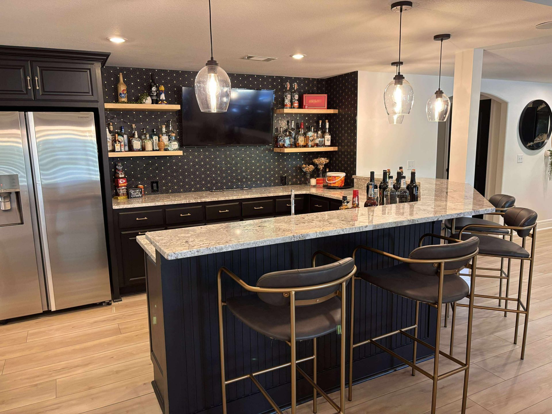 designer basement remodel, black tile, basement bar