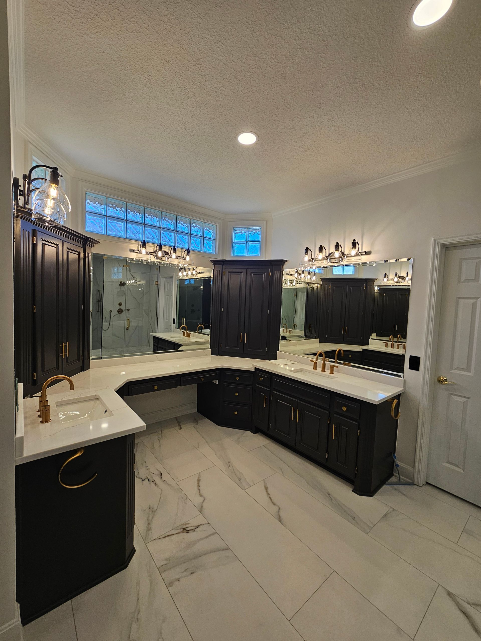 Luxury master bath suite with private toilet room in Leawood.