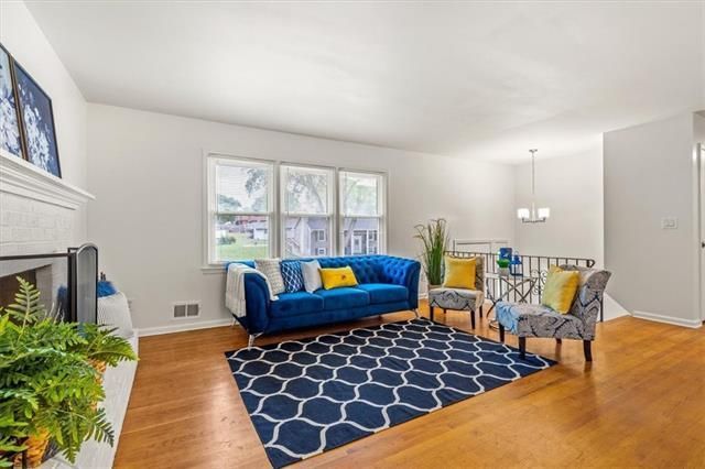 blue rug in under a blue love couch in a staged kansas city living room