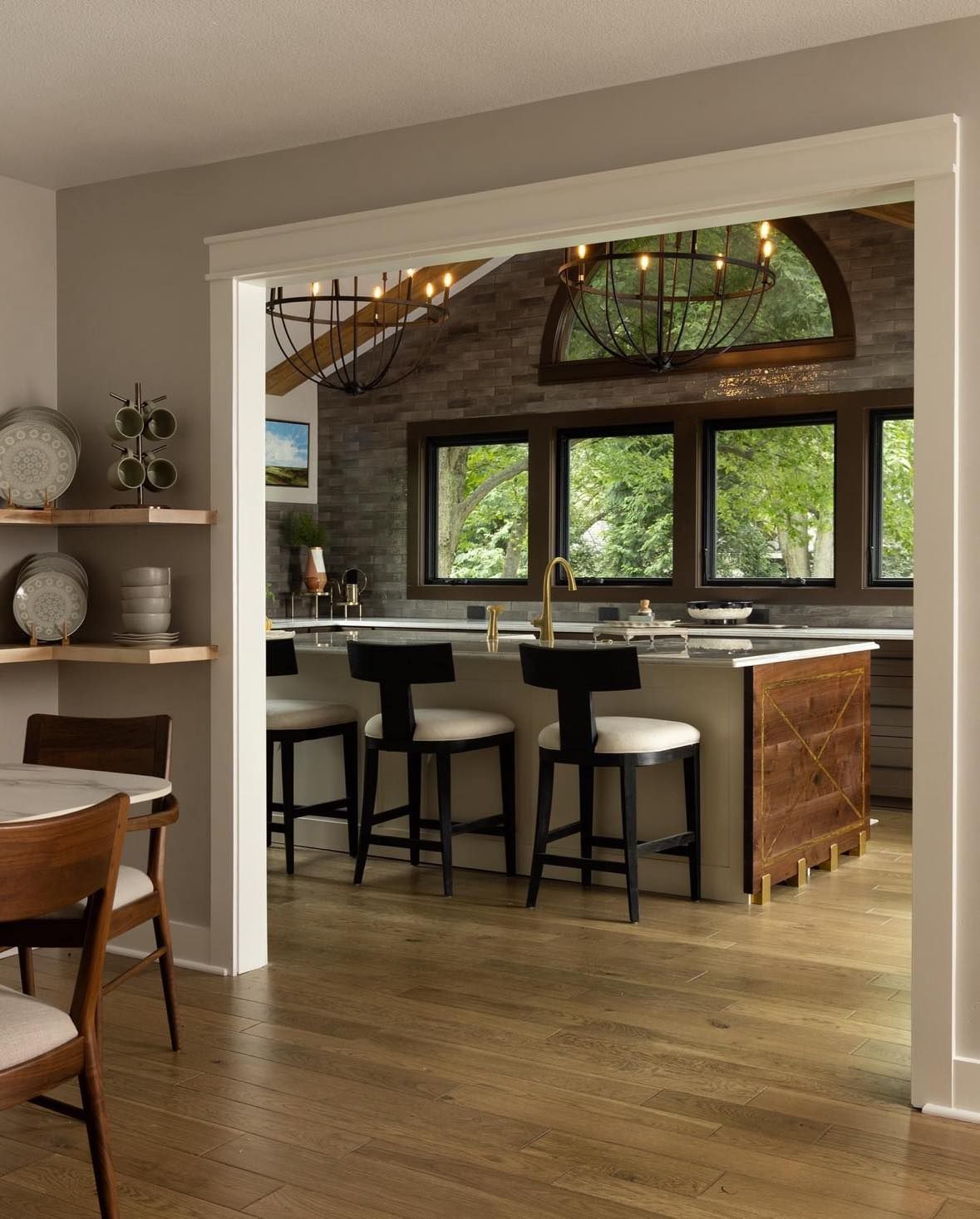 Custom wet bar area adjacent to a kitchen in Overland Park.