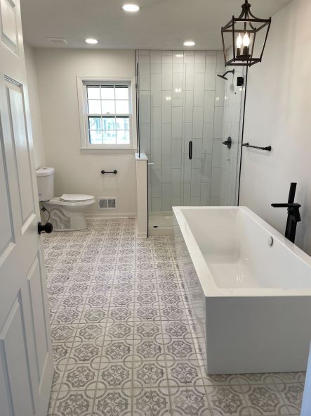 white free-standing tub with black fixtures
