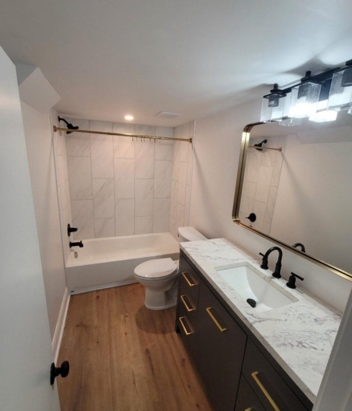 a bathroom with a toilet a sink and a bathtub