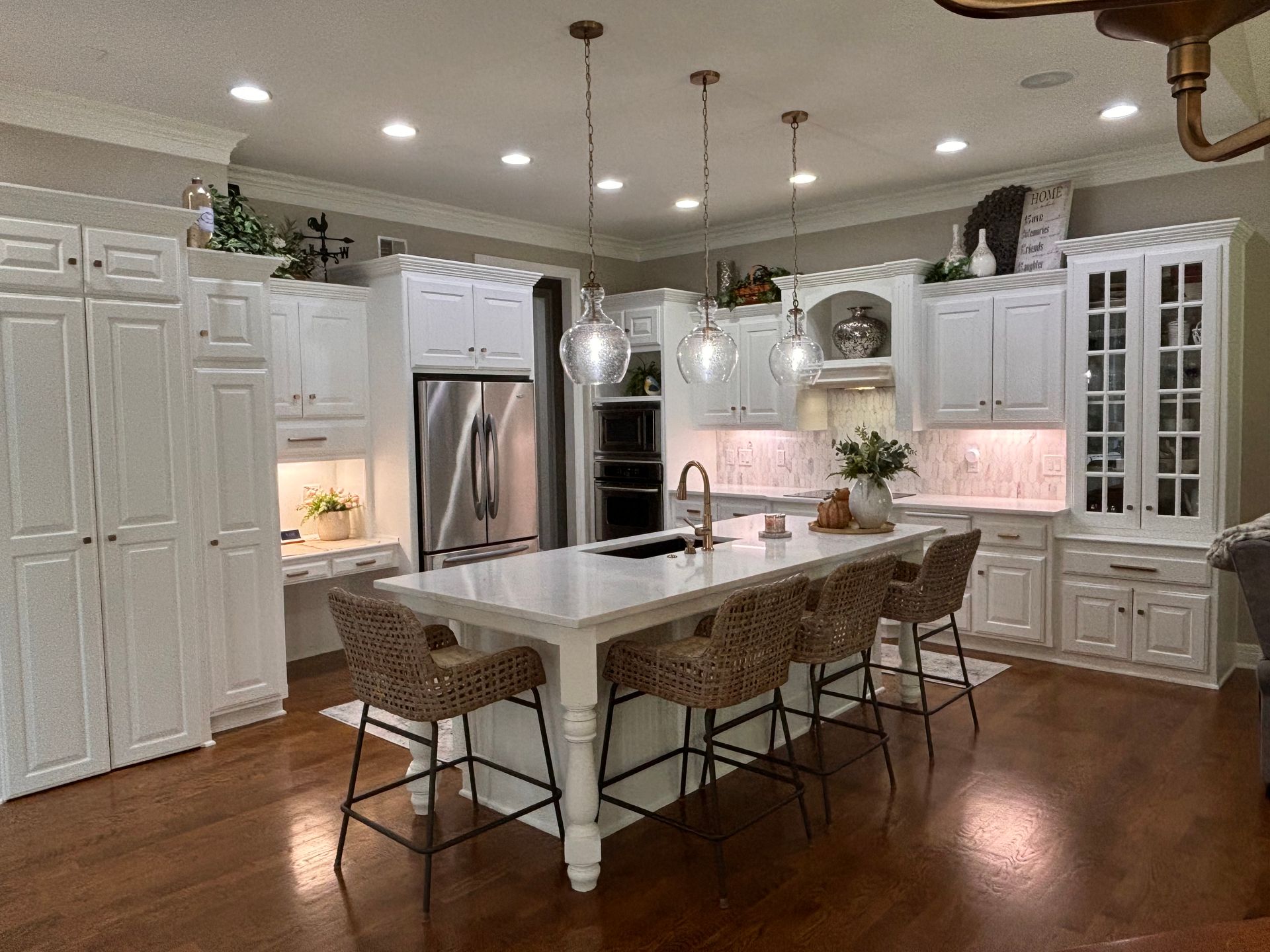 Modern open-concept kitchen remodel in Overland Park with white quartz countertops.