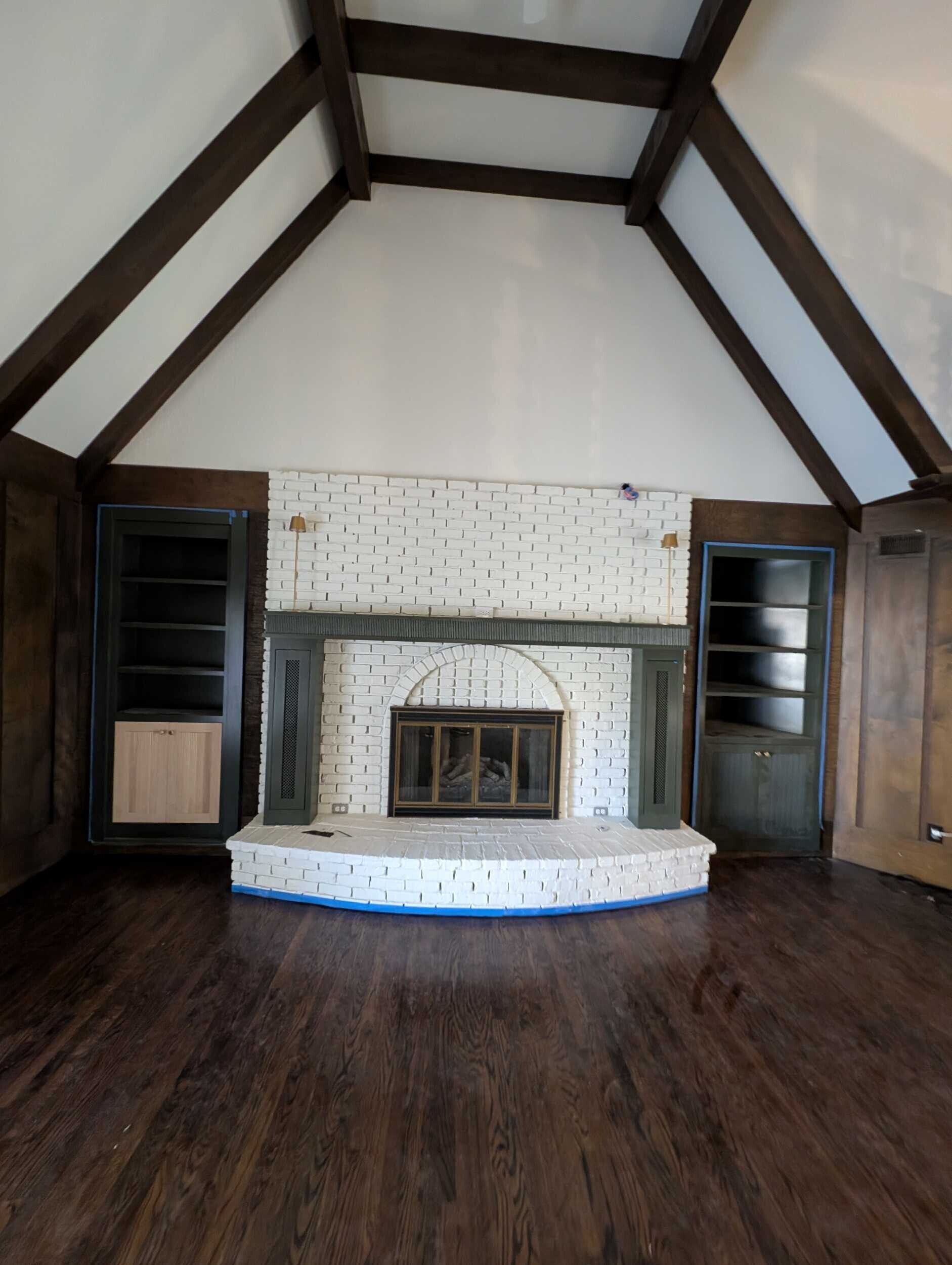 Vaulted living room ceiling with stained maple beams