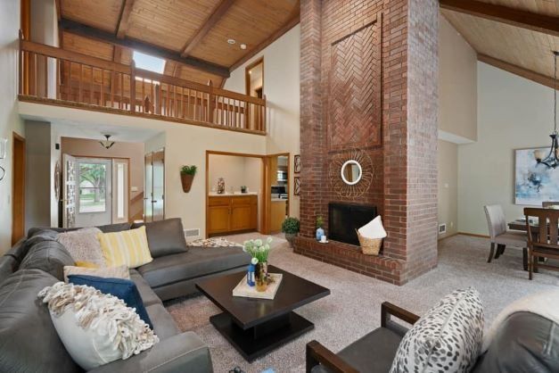 well styled living room with high ceilings in overland park, kansas