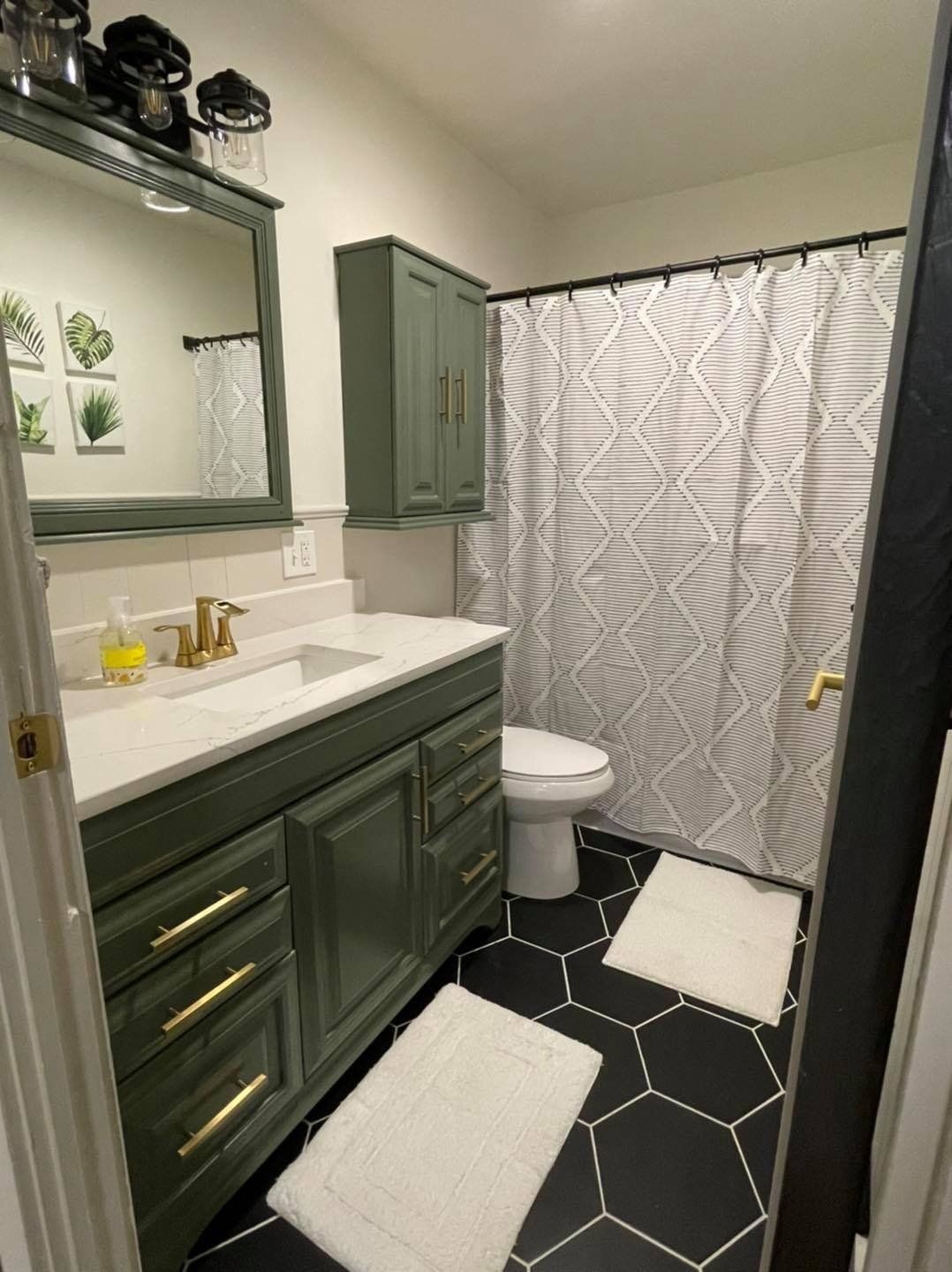moss green modern bathroom staged by Under Pressure Inc