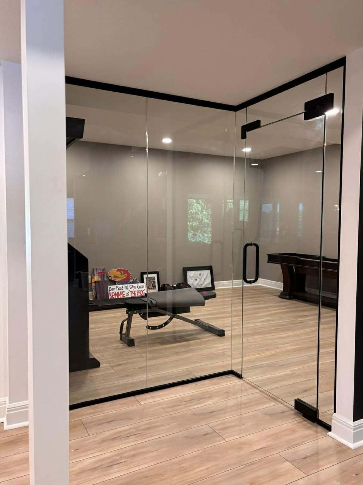 Glass entry way to basement weight room Lenexa Kansas