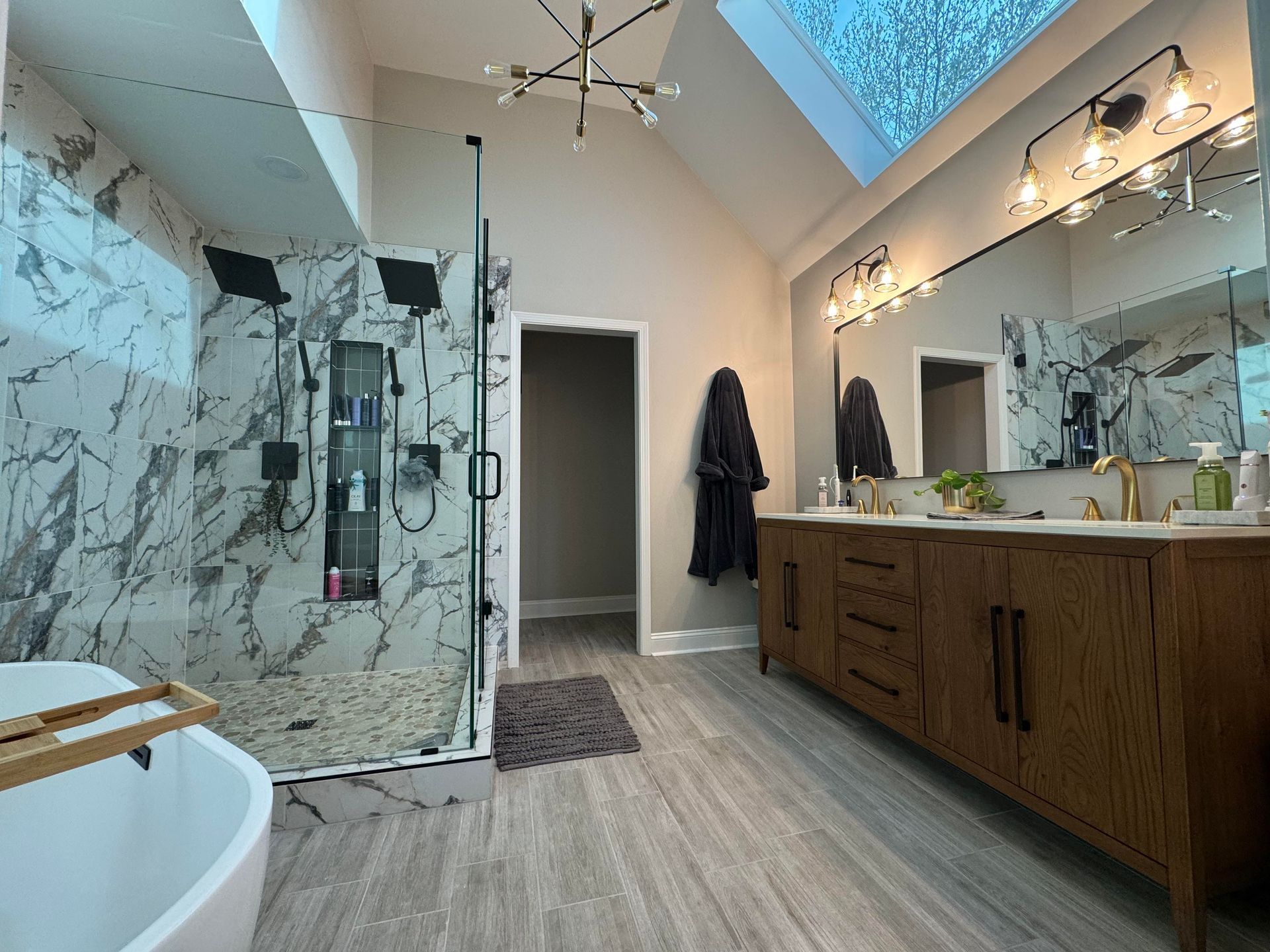 Frameless glass shower enclosure in an Olathe remodel.