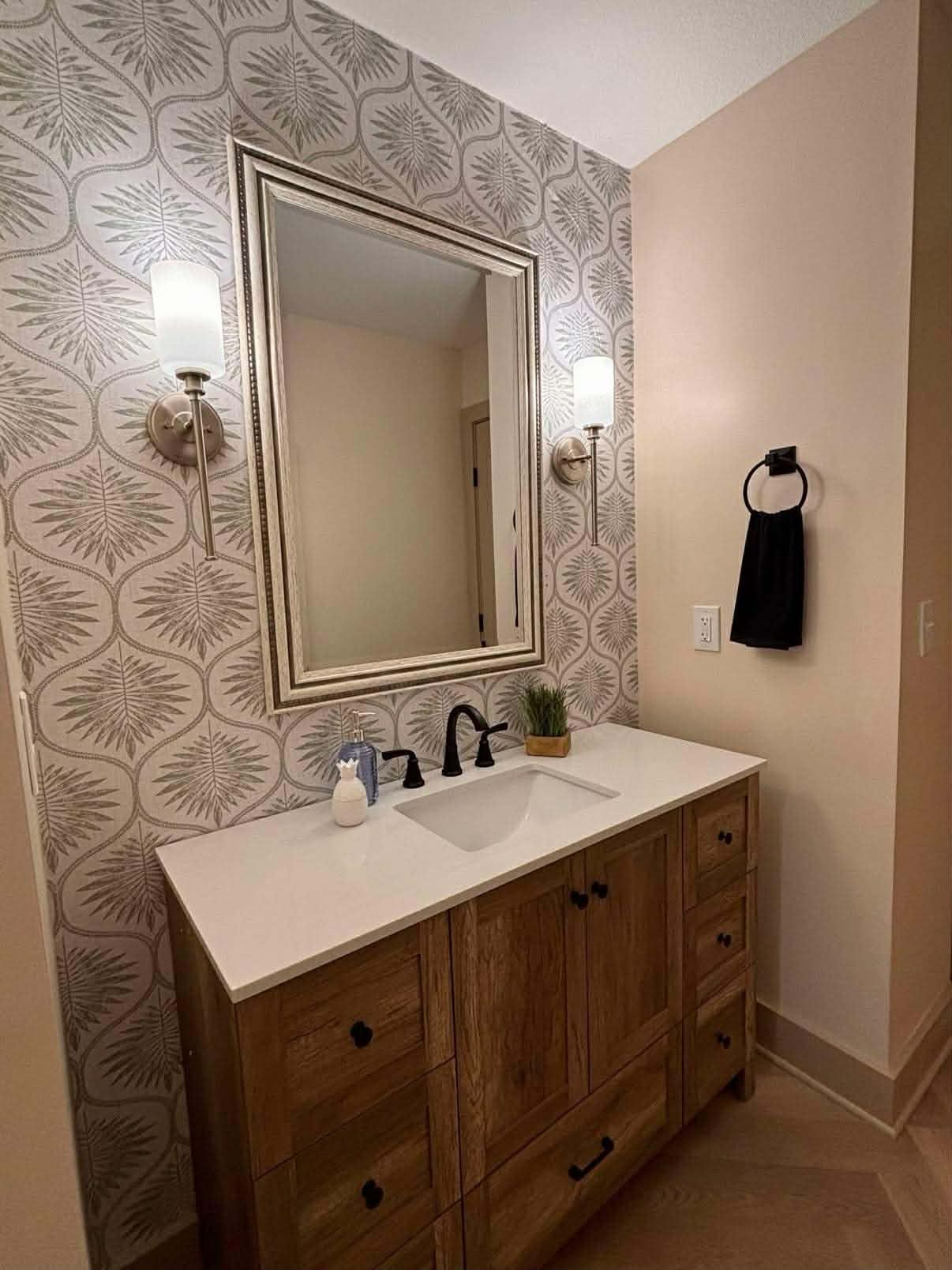 Wallpaper accent wall with sconce lights, legends Kansas