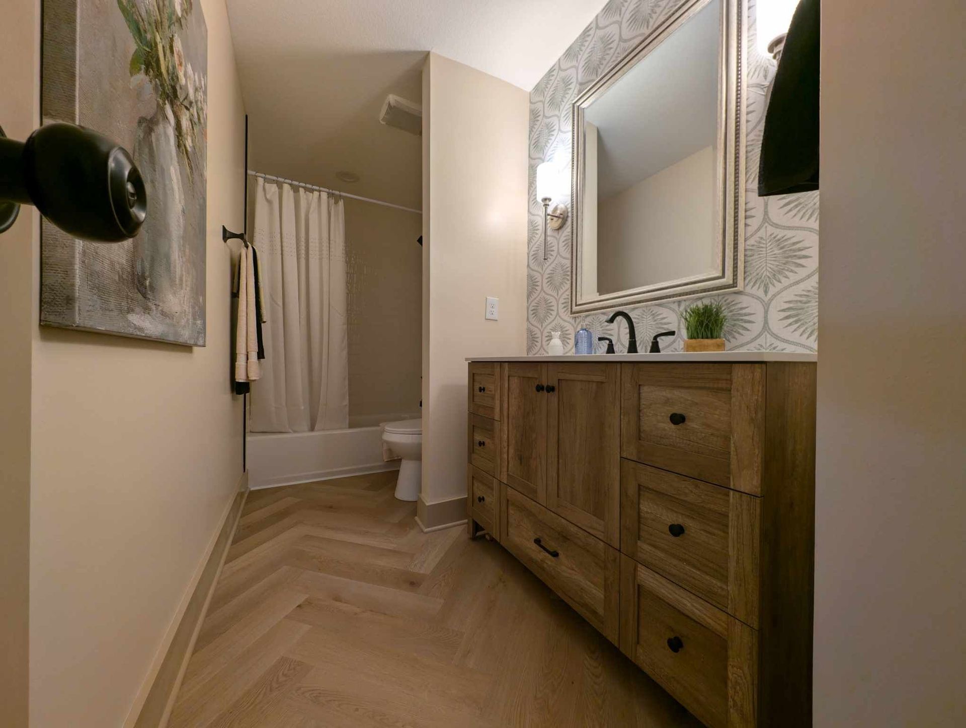 Herring bone style lvp in bathroom remodel Olathe Kansas