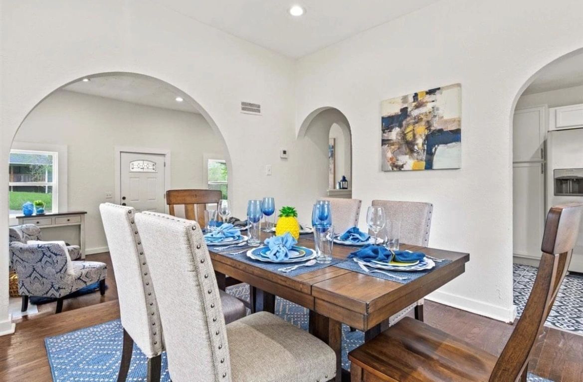 dining room with high ceilings staged before house showing