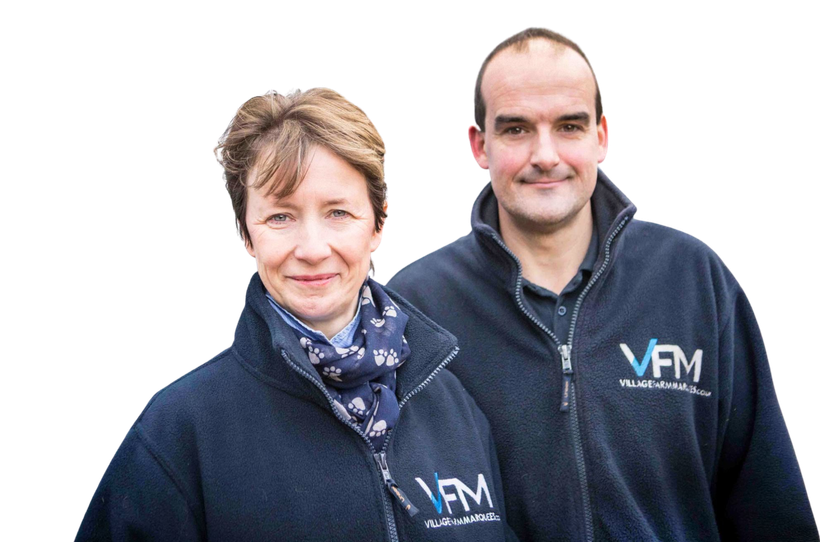 A man and a woman are standing next to each other wearing jackets that say vfm.