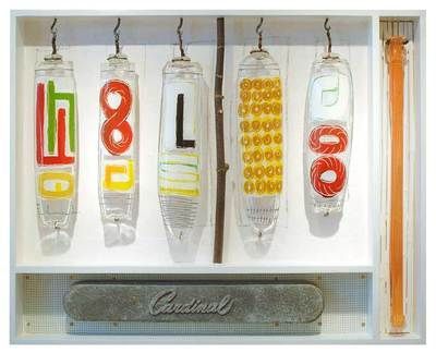 Five glass tubes with letters and numbers hang above a 