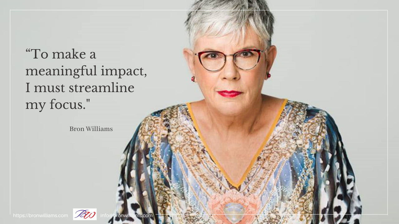 Woman with glasses and colorful shirt, text: 