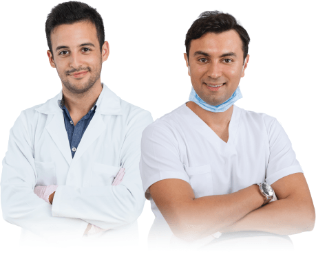 Two doctors standing next to each other with their arms crossed