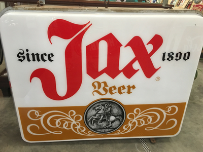 An illuminated sign reads