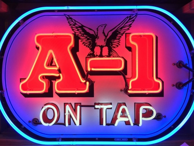 A neon sign with the red text