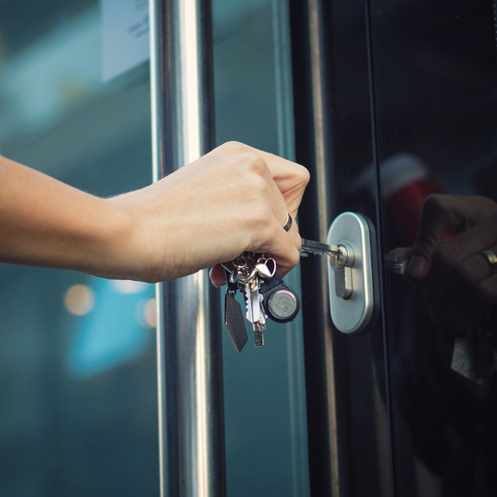Woman is Opening a Door with a Key – Leominster, MA – Jim's Lock And Key