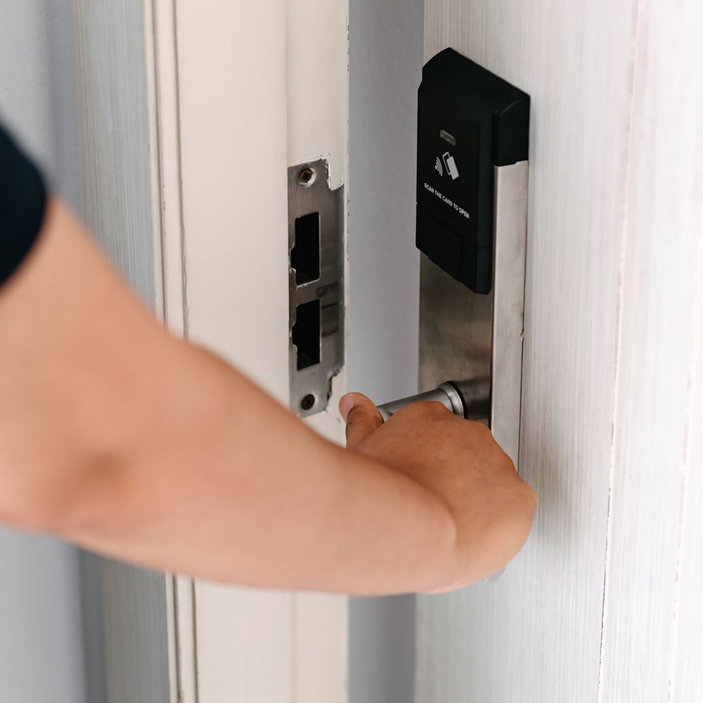 Man Opening Apartment Door – Leominster, MA – Jim's Lock And Key