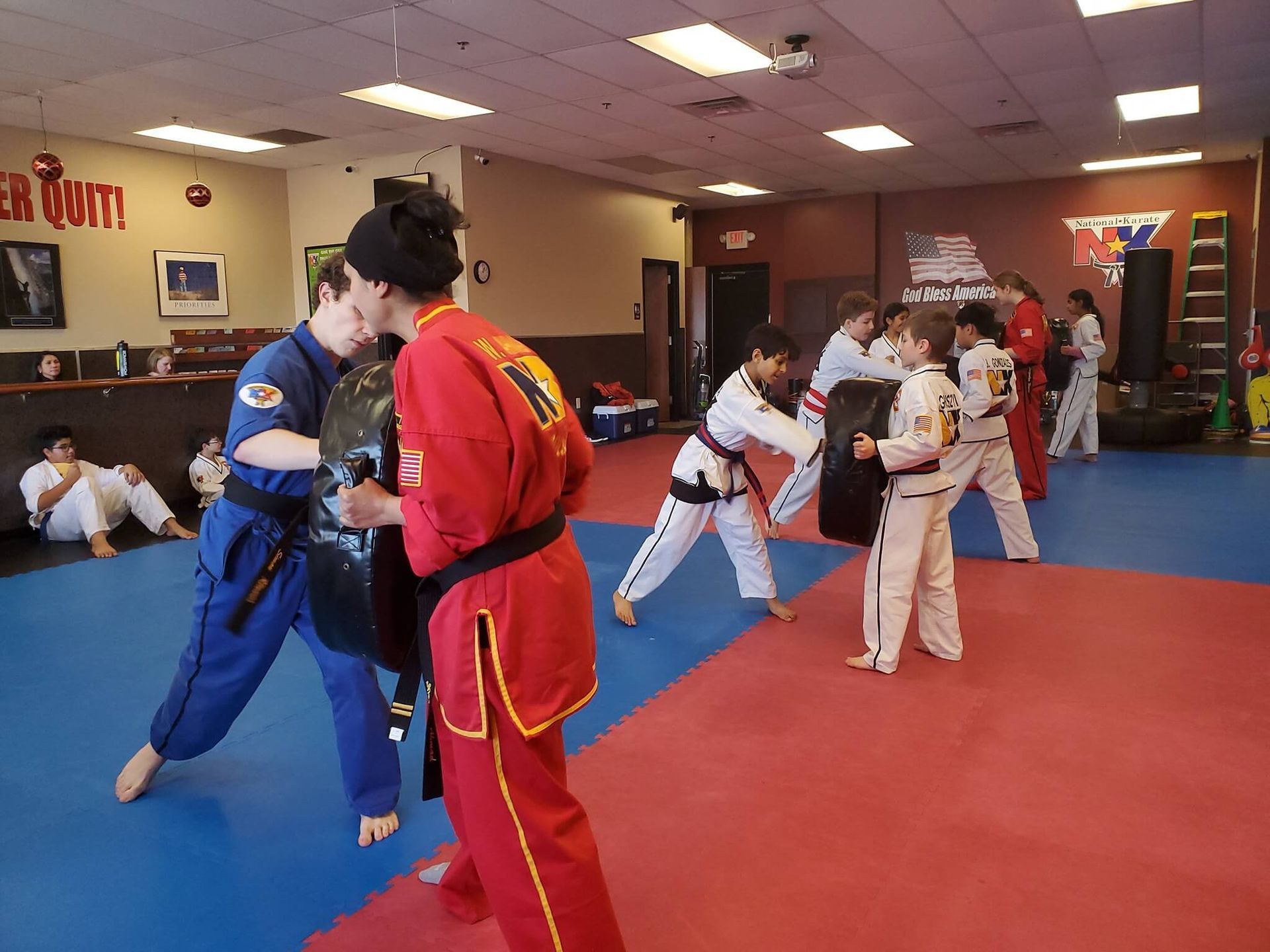 Kids practice partner drills at Wisconsin National Karate in New Berlin, WI, building confidence and friendships.