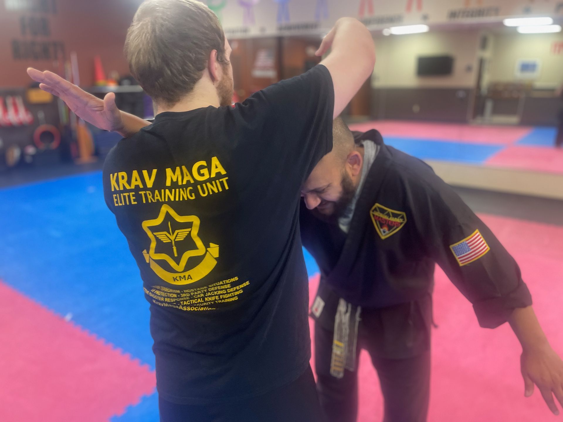 Adults practice pad drills at Wisconsin National Karate Kickboxing & Krav Maga in New Berlin, WI.