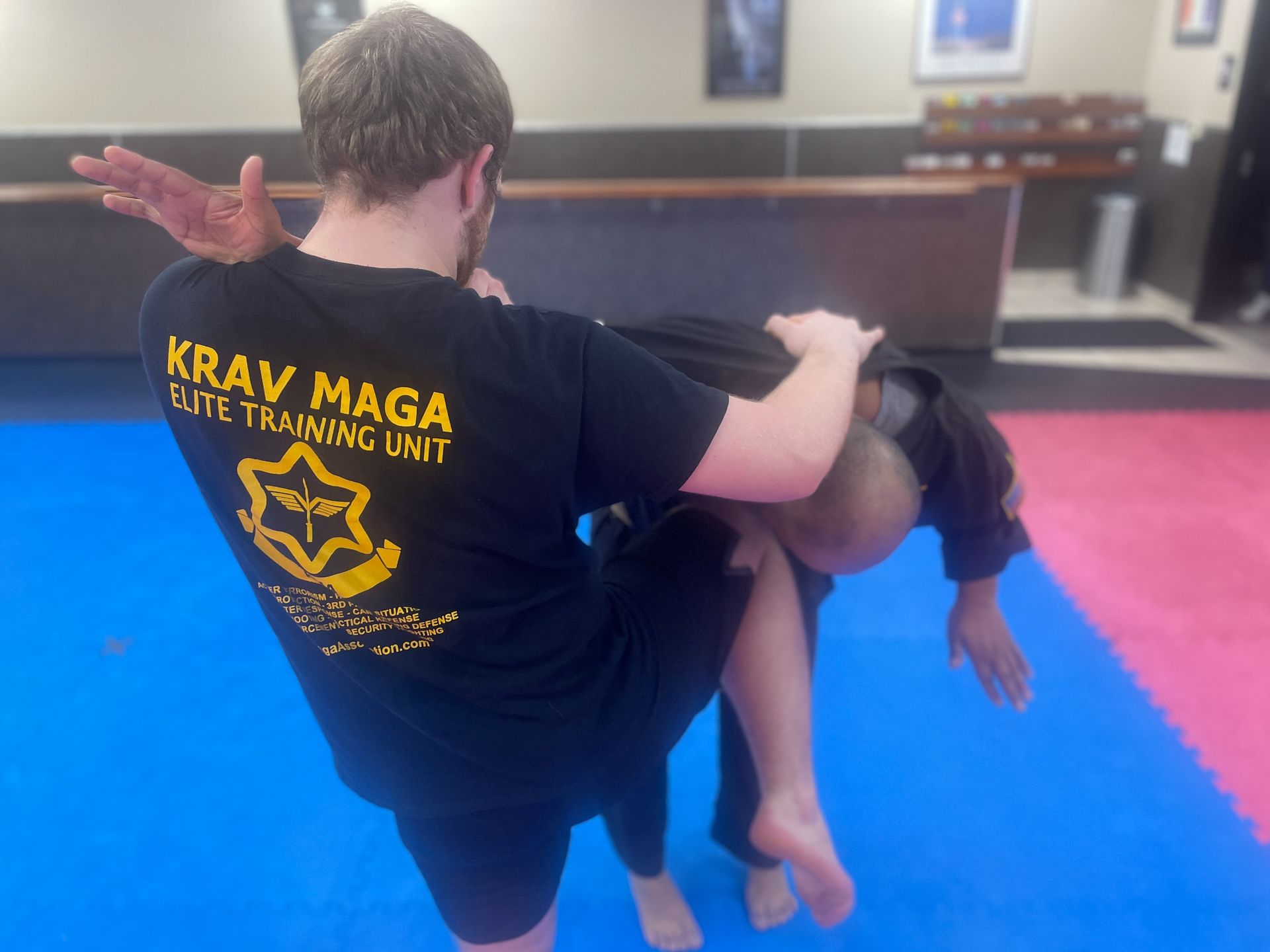 Adults practicing kickboxing combinations at Wisconsin National Karate Kickboxing & Krav Maga.