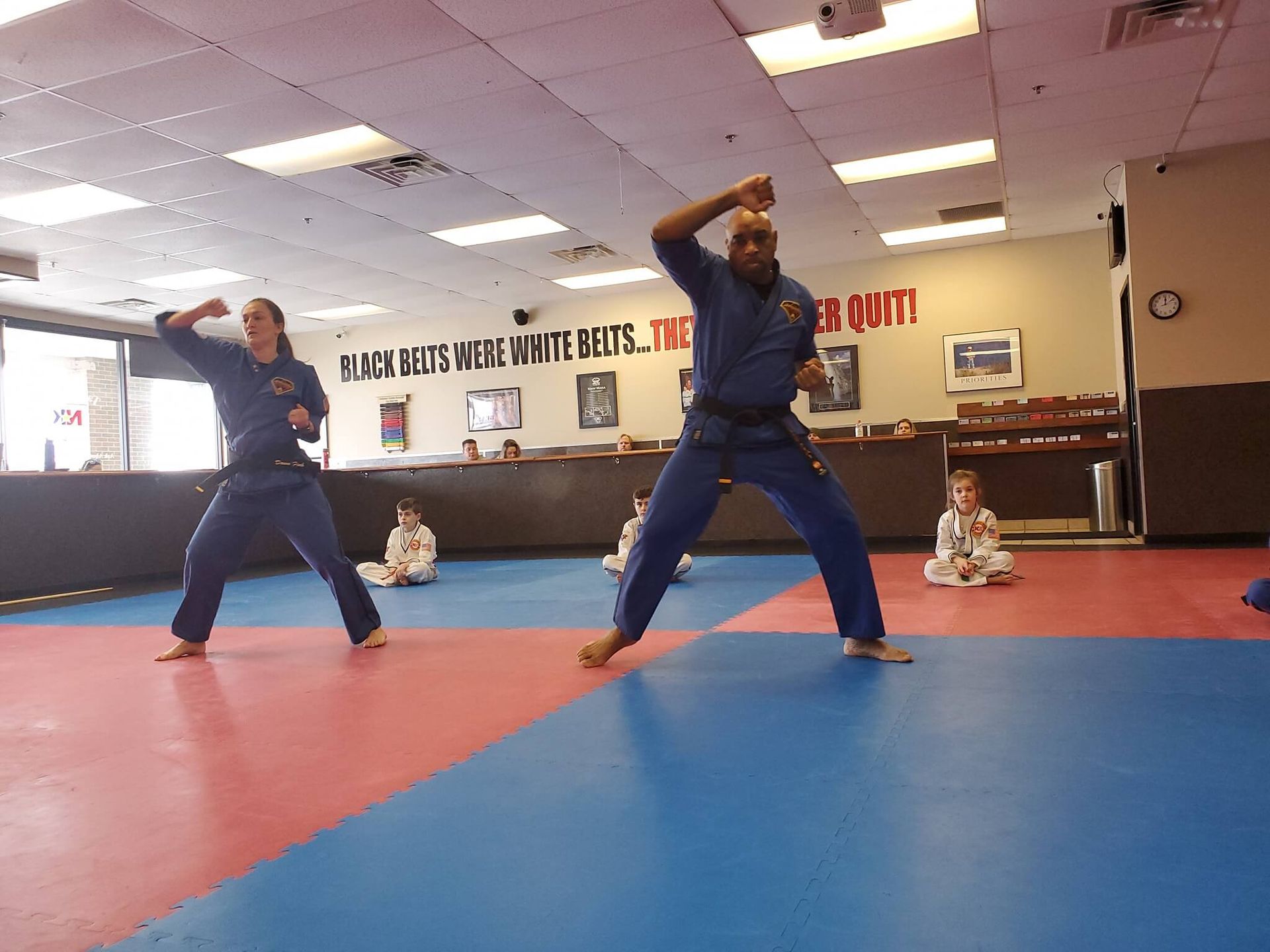 Adults practice focused karate drills at Wisconsin National Karate Kickboxing & Krav Maga.