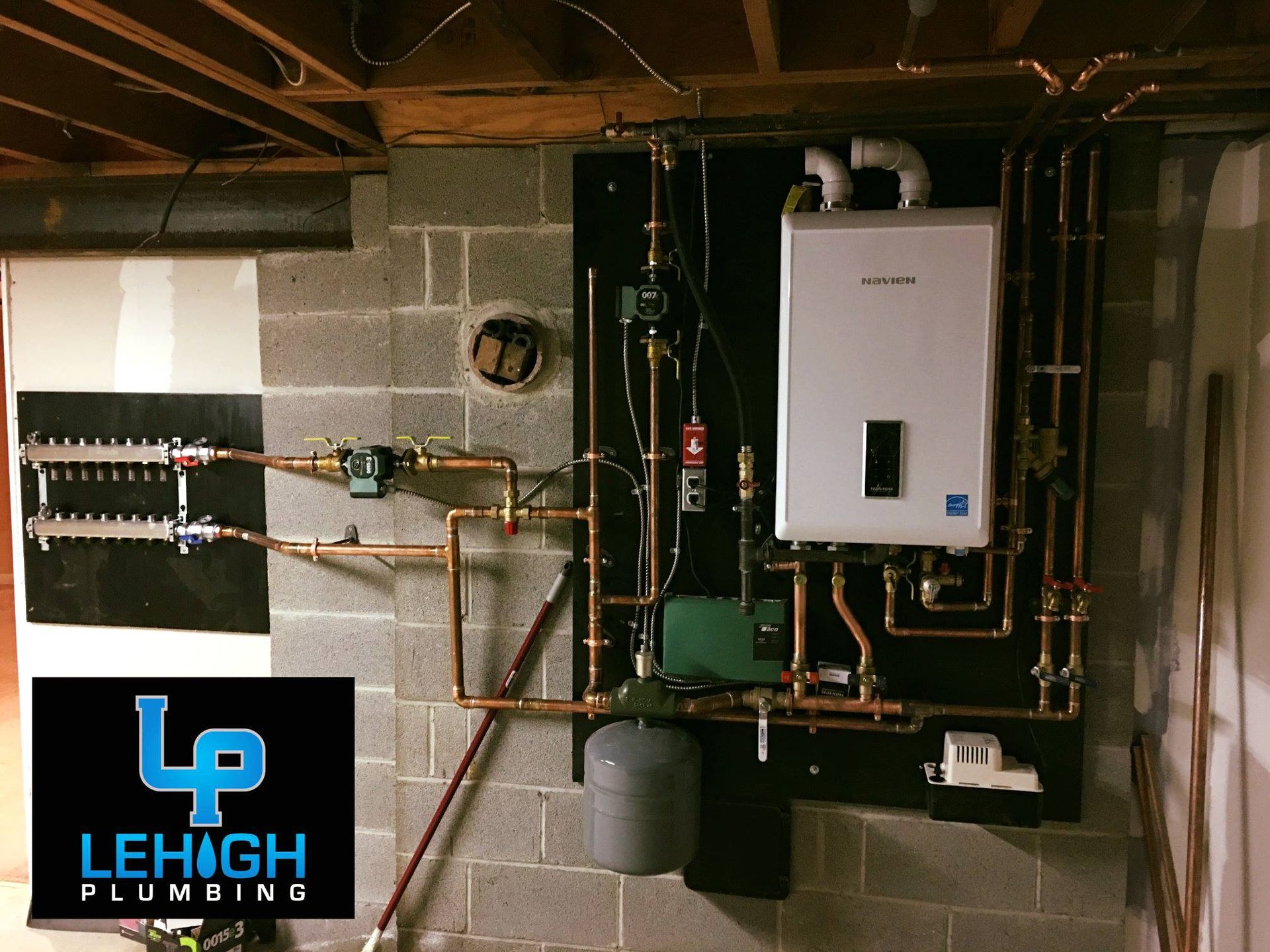 A sign for lehigh plumbing hangs on a wall