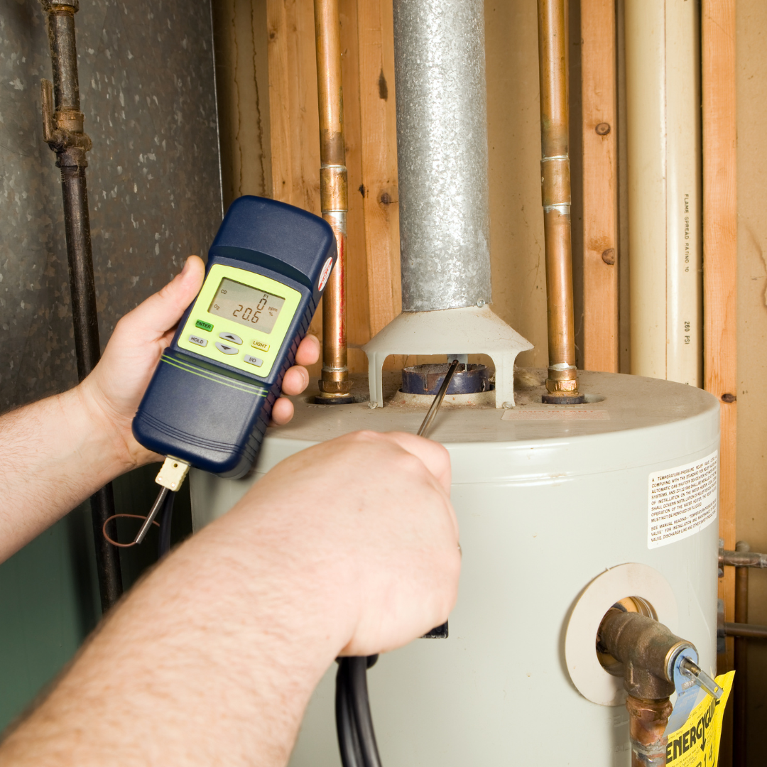 A person is measuring the temperature of a water heater