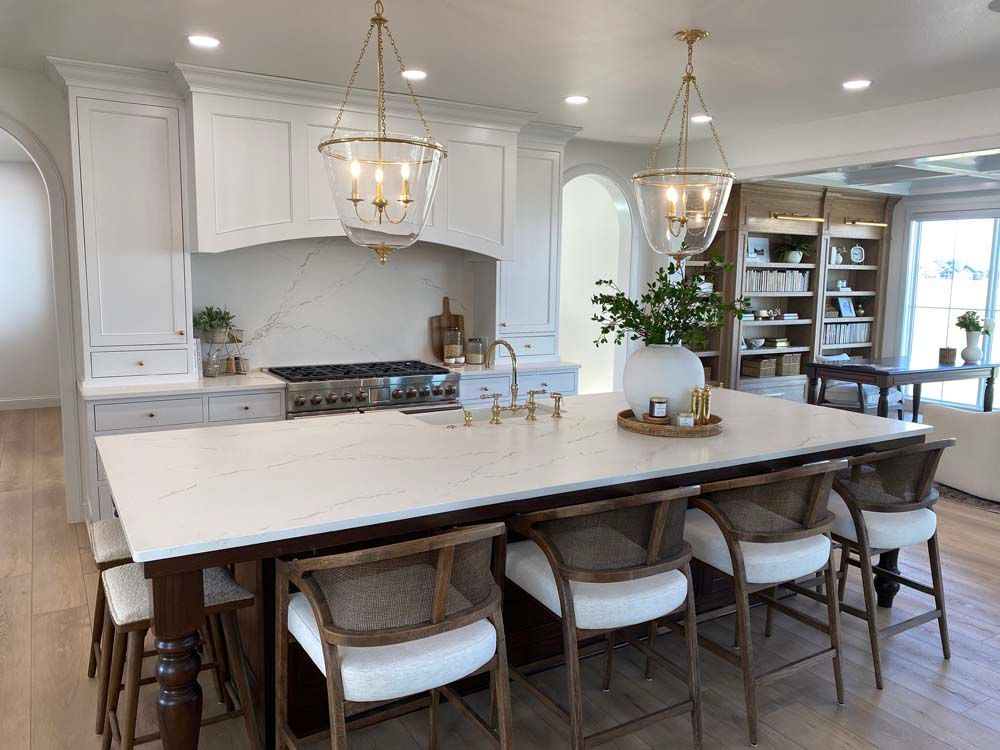 There is a large island in the middle of the kitchen.