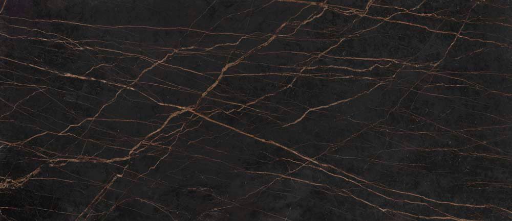 A close up of a black marble counter top with a marble texture.