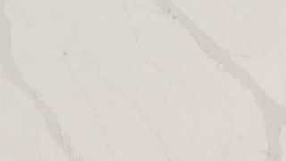 A close up of a white marble counter top.