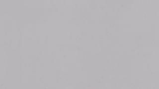 A close up of a plain gray background.