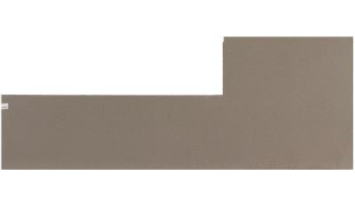 A piece of paper with a sticker on it is sitting on a white surface.