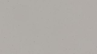 A close up of a white surface with a lot of small dots on it.