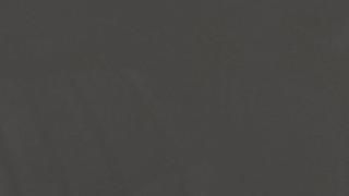 A close up of a gray background with a plain texture.