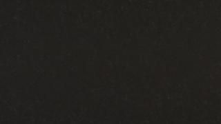 A close up of a black fabric texture.