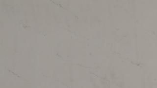 A close up of a white marble counter top.